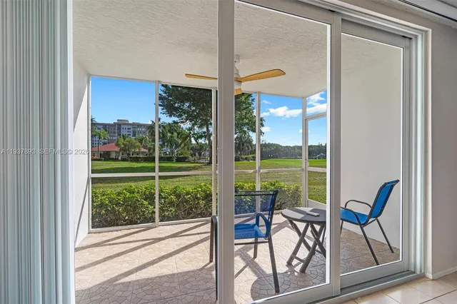 a view of a room with a furniture and garden
