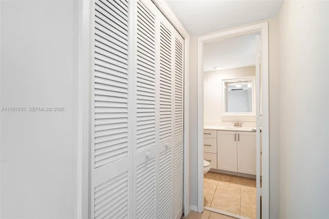 a bathroom with a window and a sink