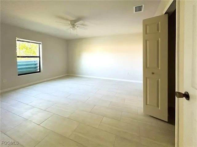 a view of an empty room with a window