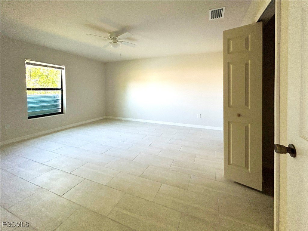 3608 Southwest 17th Avenue Cape Coral, FL 33914 - Photo 6 of 10 a view of an empty room with a window