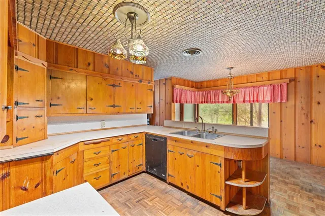 a kitchen with stainless steel appliances granite countertop a sink and cabinets