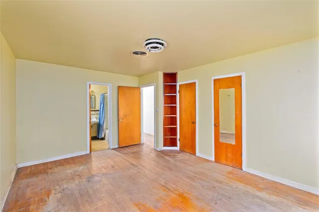 a bathroom with a toilet sink and shower