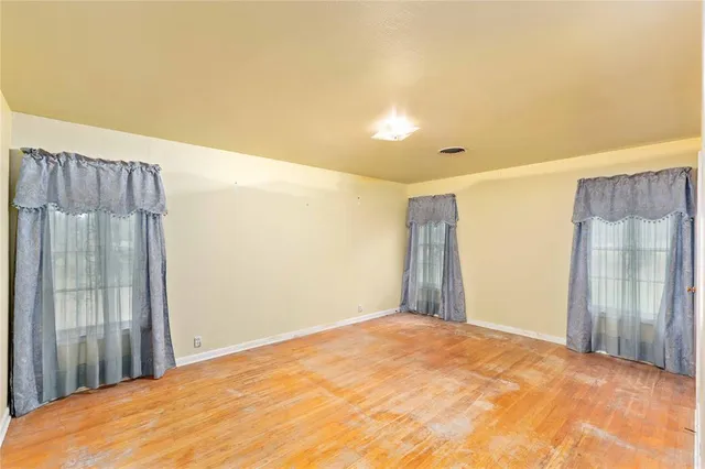 a view of a house with trees in the background