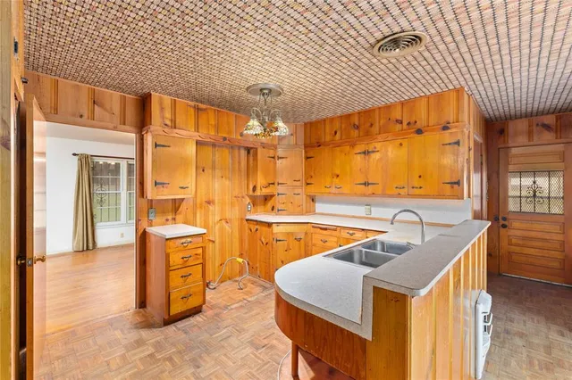 a kitchen that has a sink and a stove