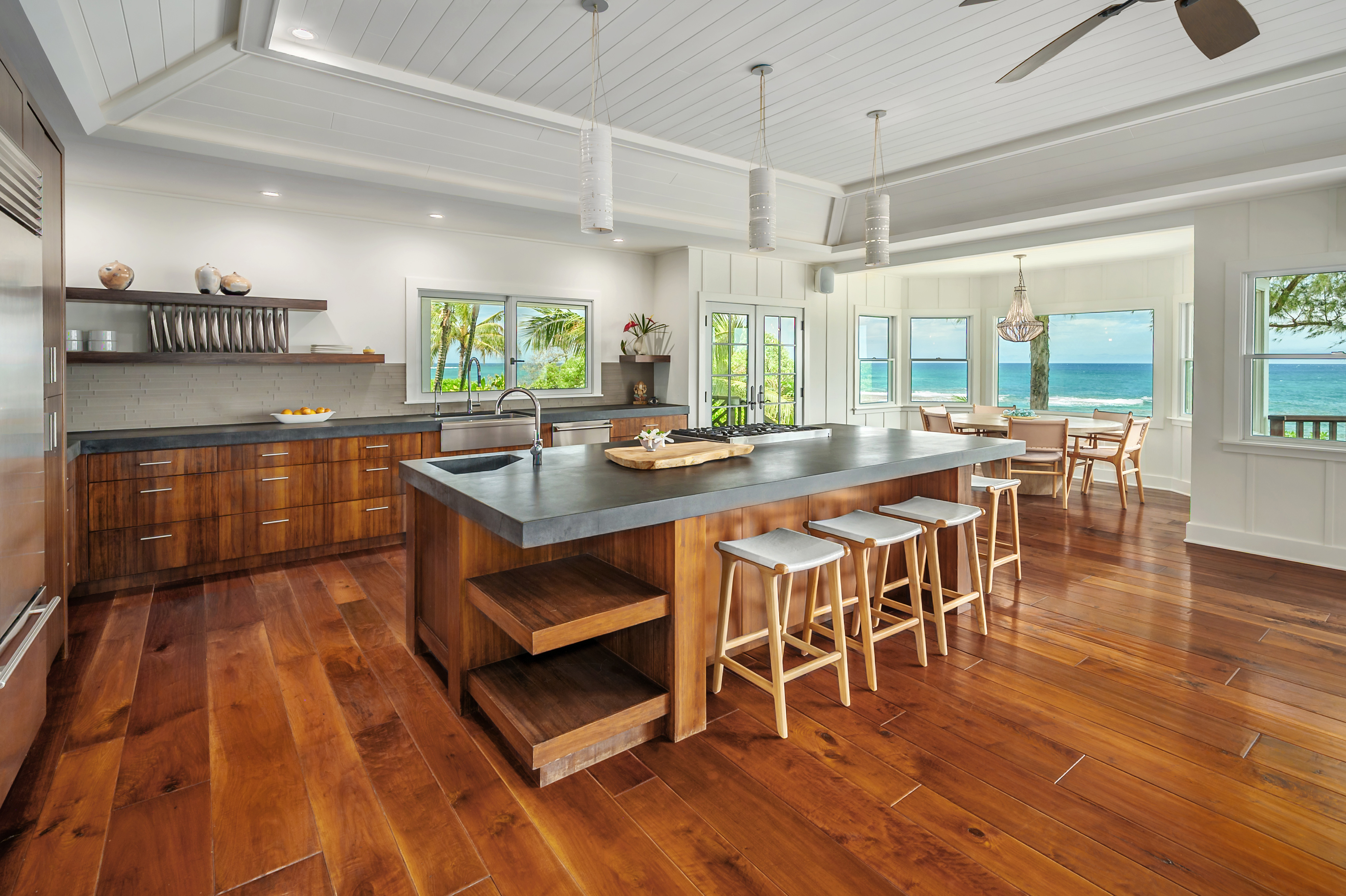 7336 Alealea Road Hanalei, HI 96714 - Photo 7 of 30 a dining hall with stainless steel appliances granite countertop a stove and a wooden floors