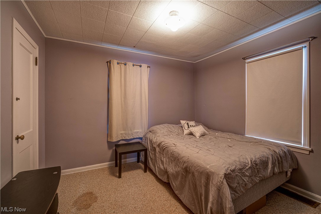 4932 Arbor Road Southwest Canton, OH 44710 - Photo 15 of 31 Bedroom featuring light carpet.