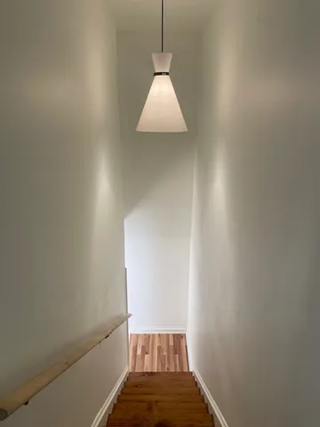 a view of a hallway with a window