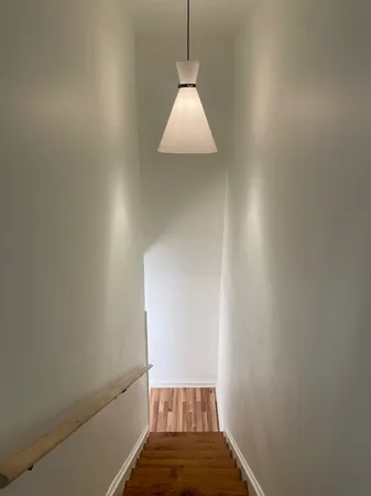 a view of a hallway with a window