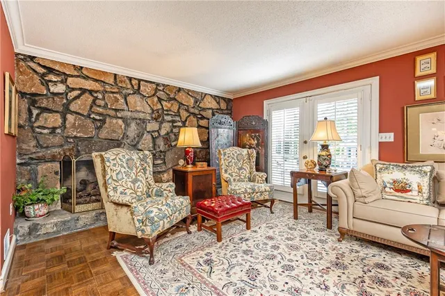a living room with furniture and a rug