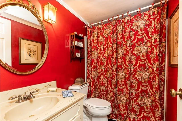 a bathroom with a toilet and a sink