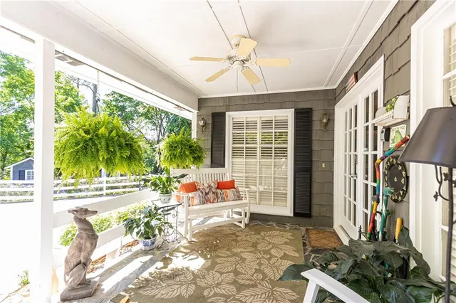 a living room filled with furniture and a large window