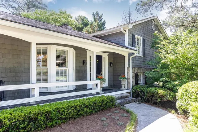 a front view of a house with garden