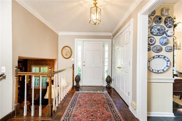 a view of an entryway with wooden floor