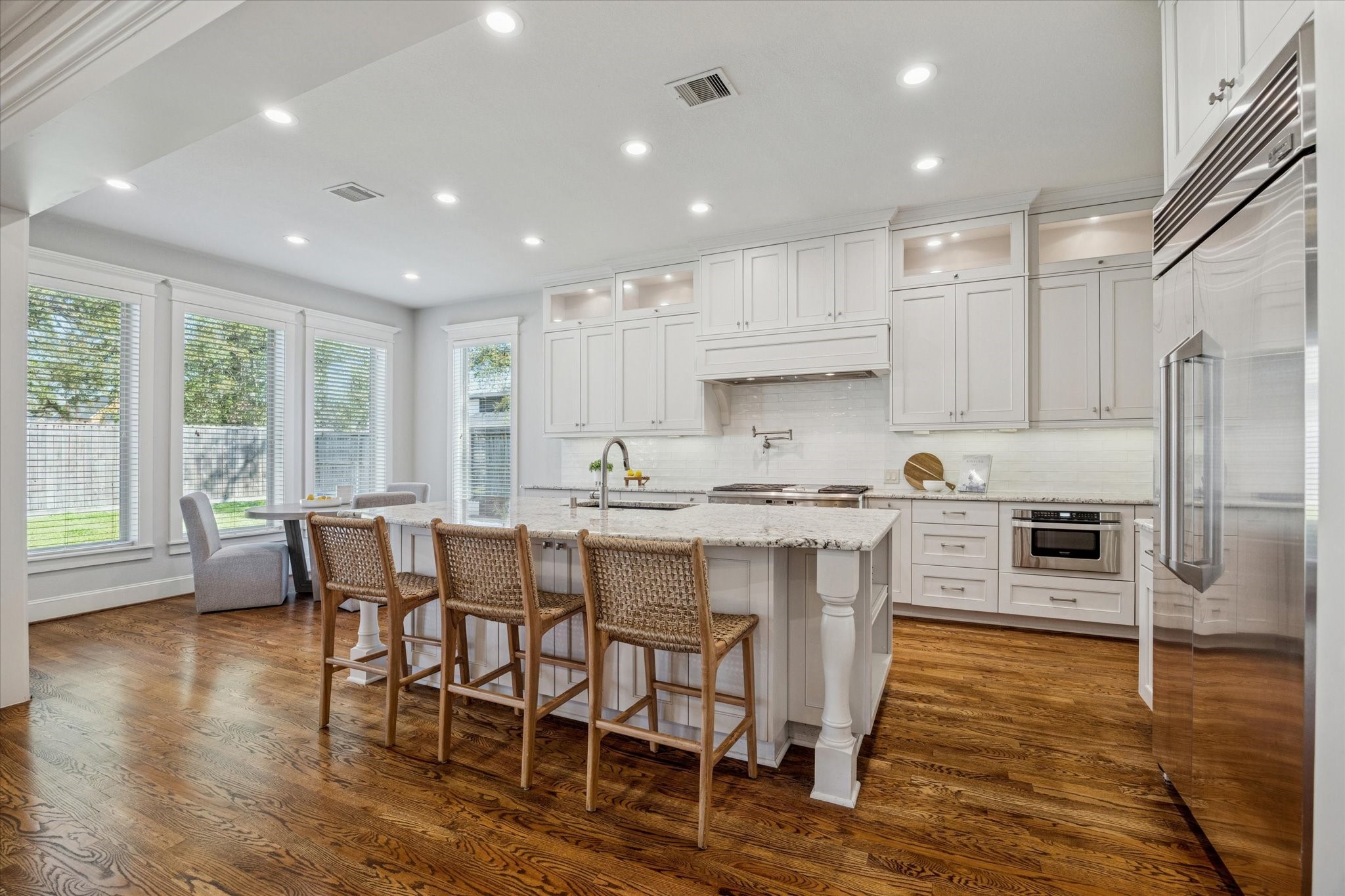 1802 Wakefield Drive Houston, TX 77018 - Photo 14 of 47 Expansive island with sleek finishes, ideal for meal prep, casual dining, and entertaining guests.
