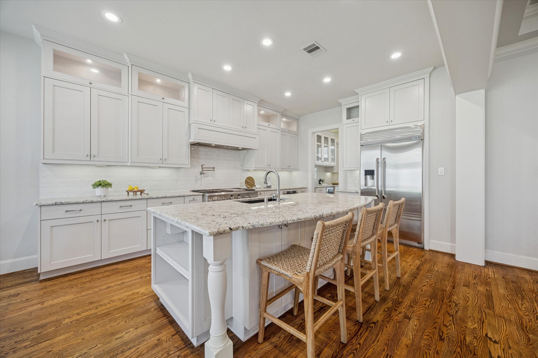 1802 Wakefield Drive Houston, TX 77018 - Photo 15 of 47 Bright, modern kitchen featuring sleek cabinetry, abundant natural light, and a clean, open layout.