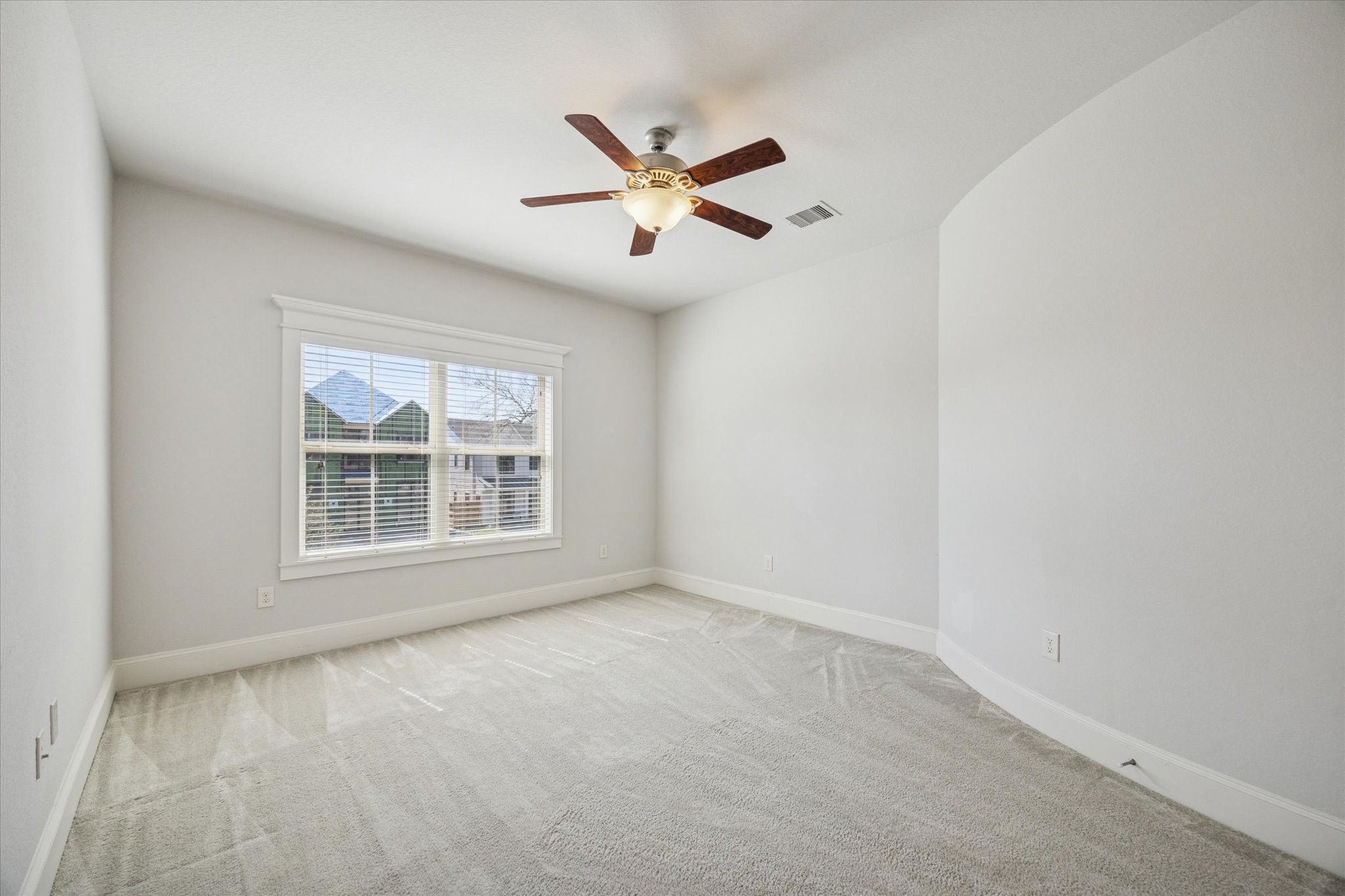 1802 Wakefield Drive Houston, TX 77018 - Photo 30 of 47 Guest room features a large window, ceiling fan with light kit and a neutral color palette. Ample room to customize the layout to suit your needs.