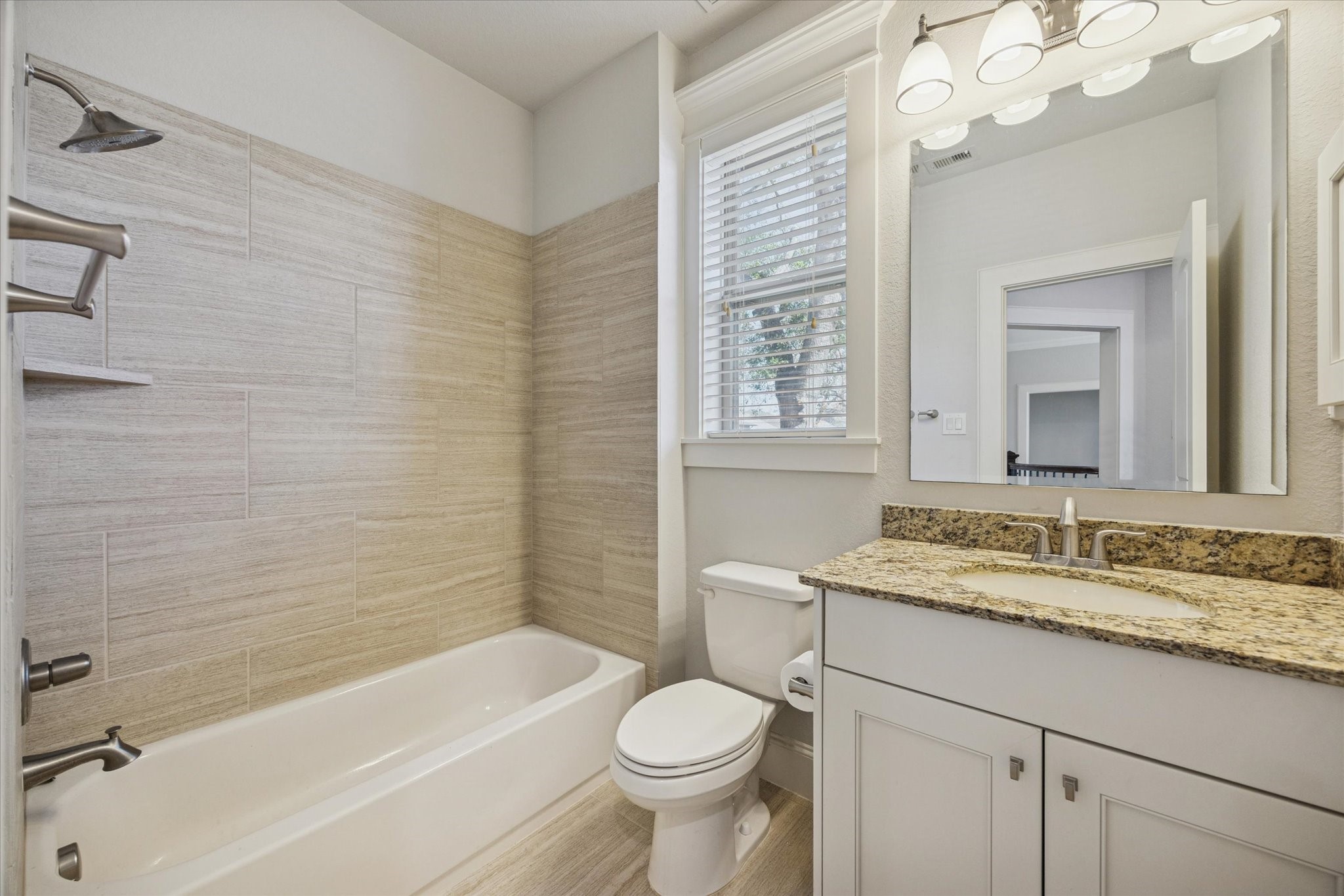 1802 Wakefield Drive Houston, TX 77018 - Photo 33 of 47 Updated guest bath offering clean lines, practical design, and functional finishes.