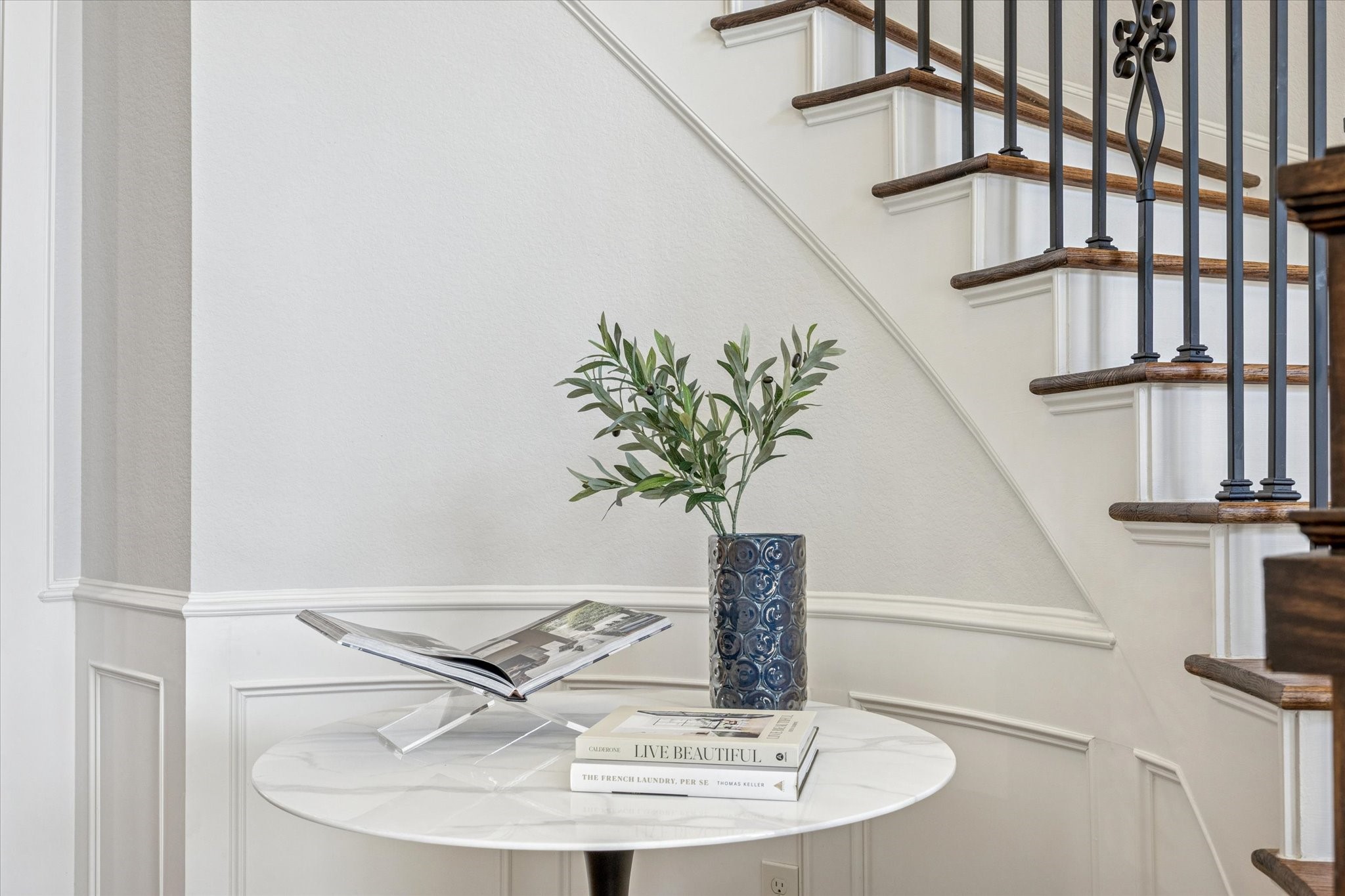1802 Wakefield Drive Houston, TX 77018 - Photo 8 of 47 Sophisticated crown molding and stair railing detail highlight the home’s craftsmanship.