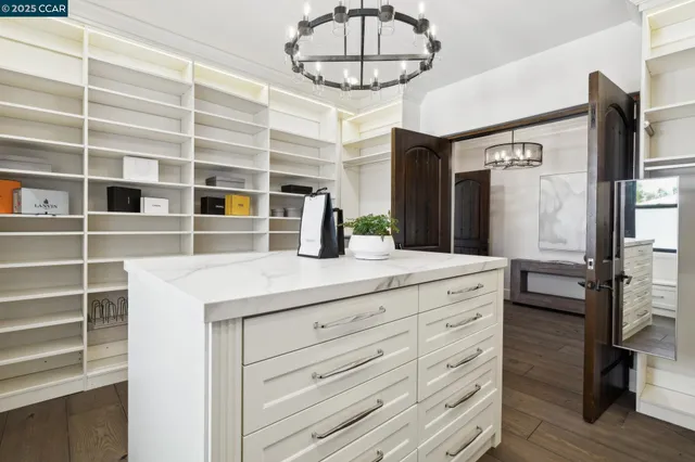 a room with pool table and windows