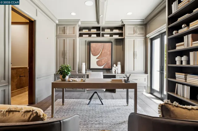 a kitchen with a wooden table and chairs