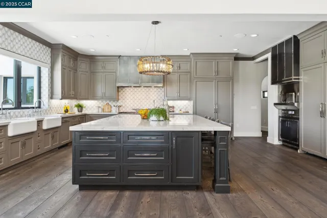 a spacious bathroom with a tub sink and mirror