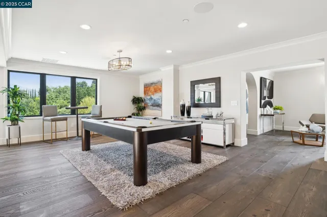 a kitchen with stainless steel appliances granite countertop a sink and a refrigerator