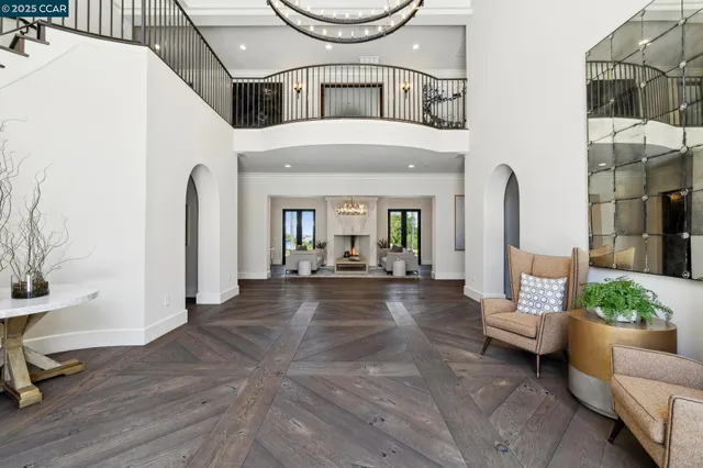 a living room with furniture or chandelier and a dining table