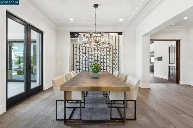 a dining room with furniture a window and appliances