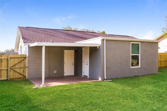 a view of a backyard of the house