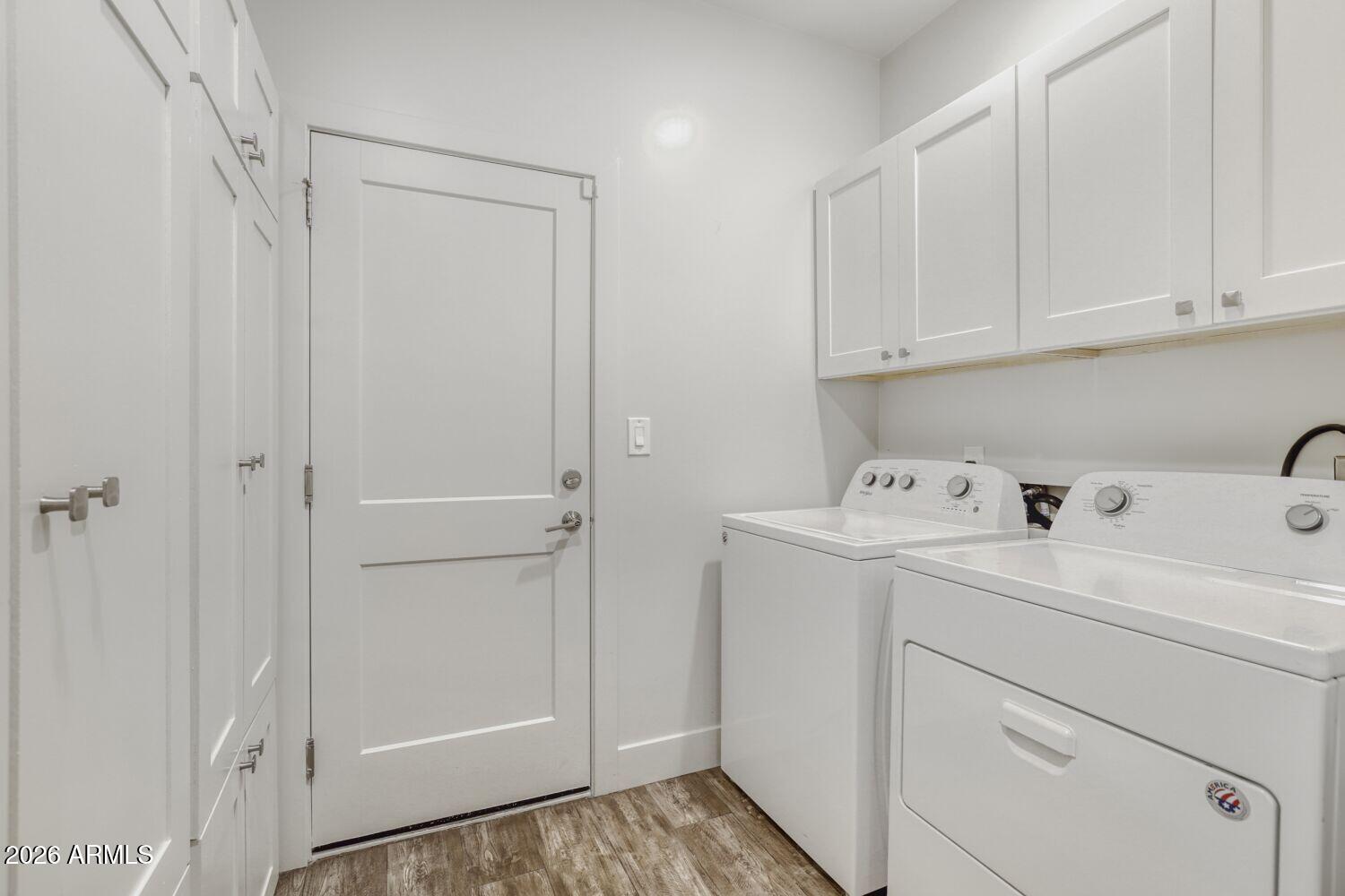 1005 East Weldon Avenue Phoenix, AZ 85014 - Photo 26 of 33 Laundry Room with Storage Cabinets