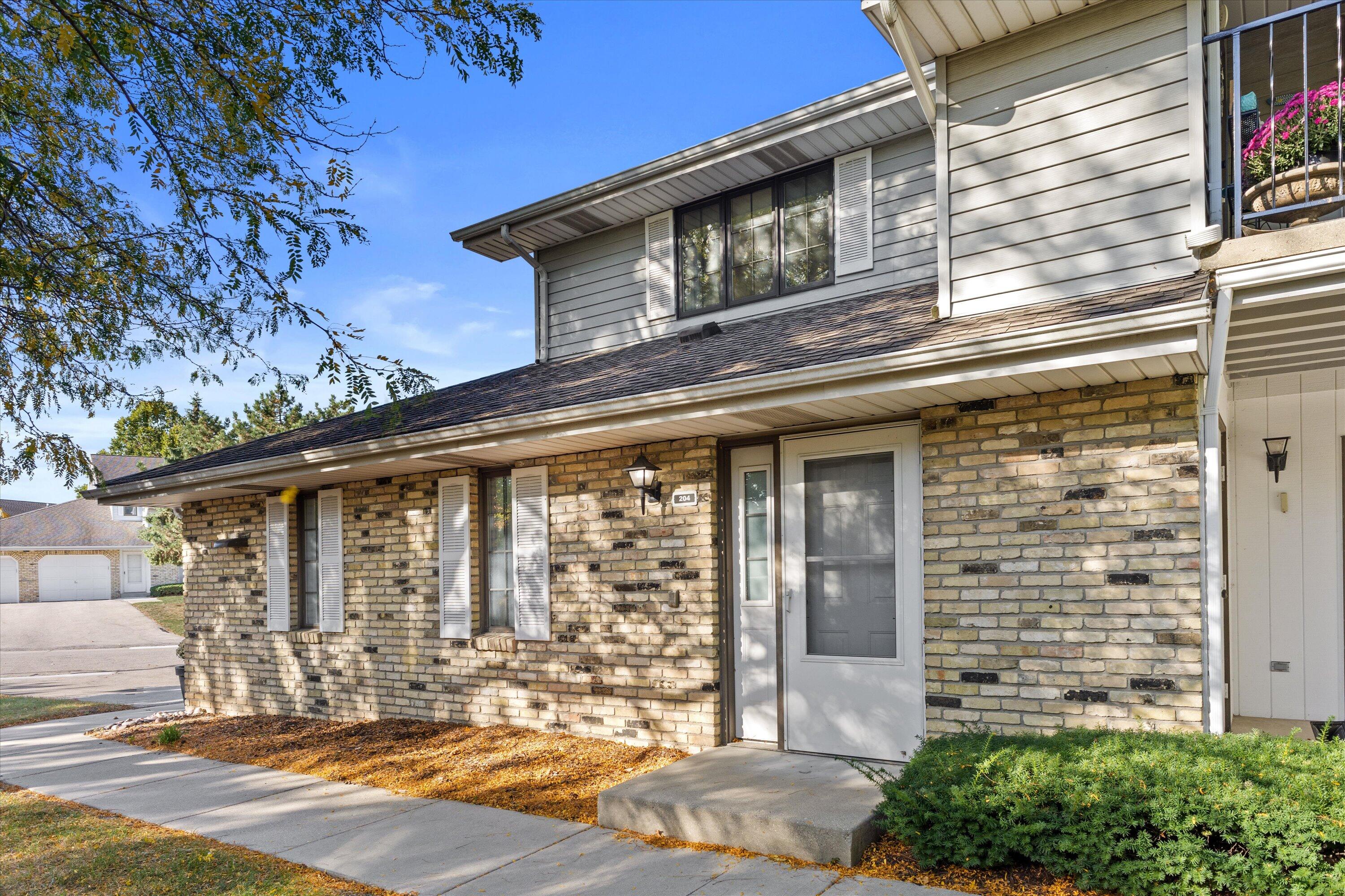 5810 Ring Neck Terrace, Unit 204 Mount Pleasant, WI 53406 - Photo 31 of 33 Primary entrance on the side of building.
