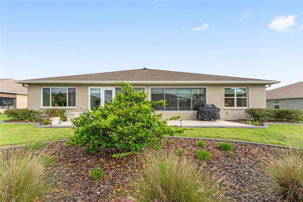 8290 Southwest 92nd Circle Ocala, FL 34481 - Photo 33 of 46 front view of house with a yard