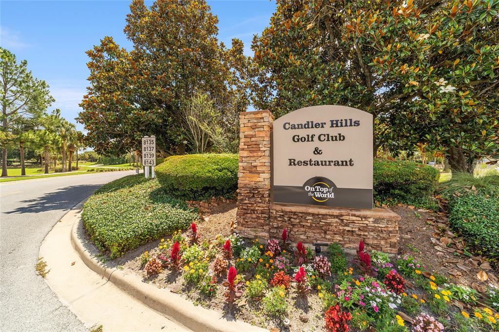 8290 Southwest 92nd Circle Ocala, FL 34481 - Photo 46 of 46 a sign that is sitting in front of flowers