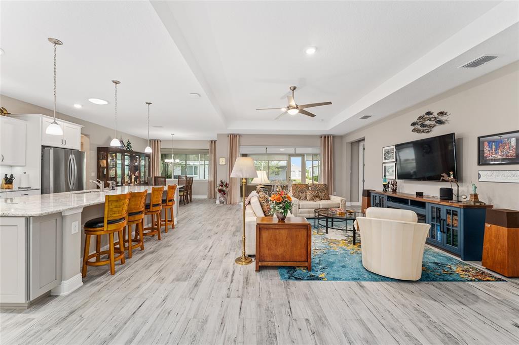8290 Southwest 92nd Circle Ocala, FL 34481 - Photo 5 of 46 a living room with furniture and a flat screen tv