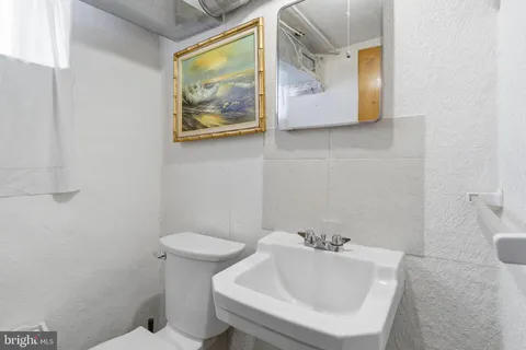 a bathroom with a toilet and sink