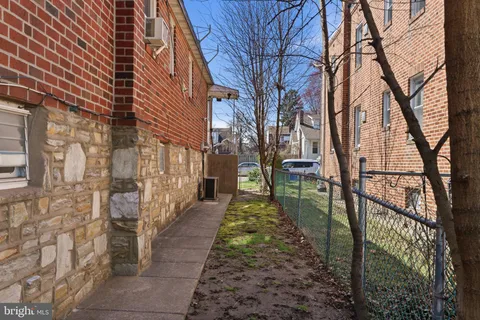 a pathway of a house with backyard