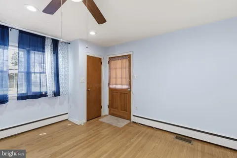 a view of an empty room with glass door