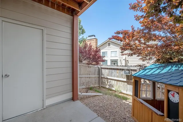 a view of residential house with wooden fence