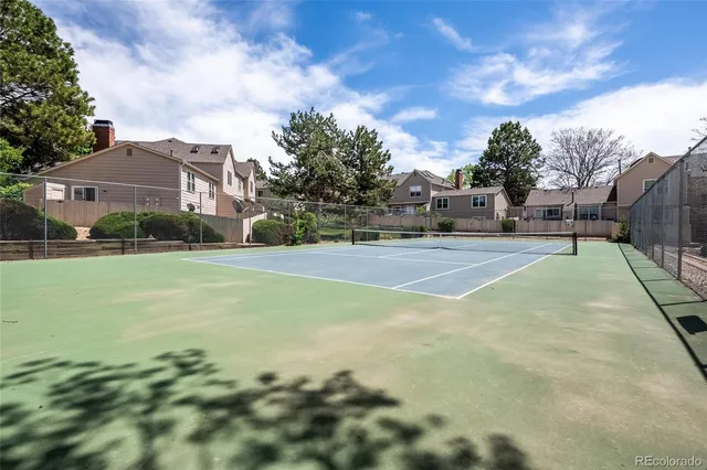 a view of a playground with basketball court