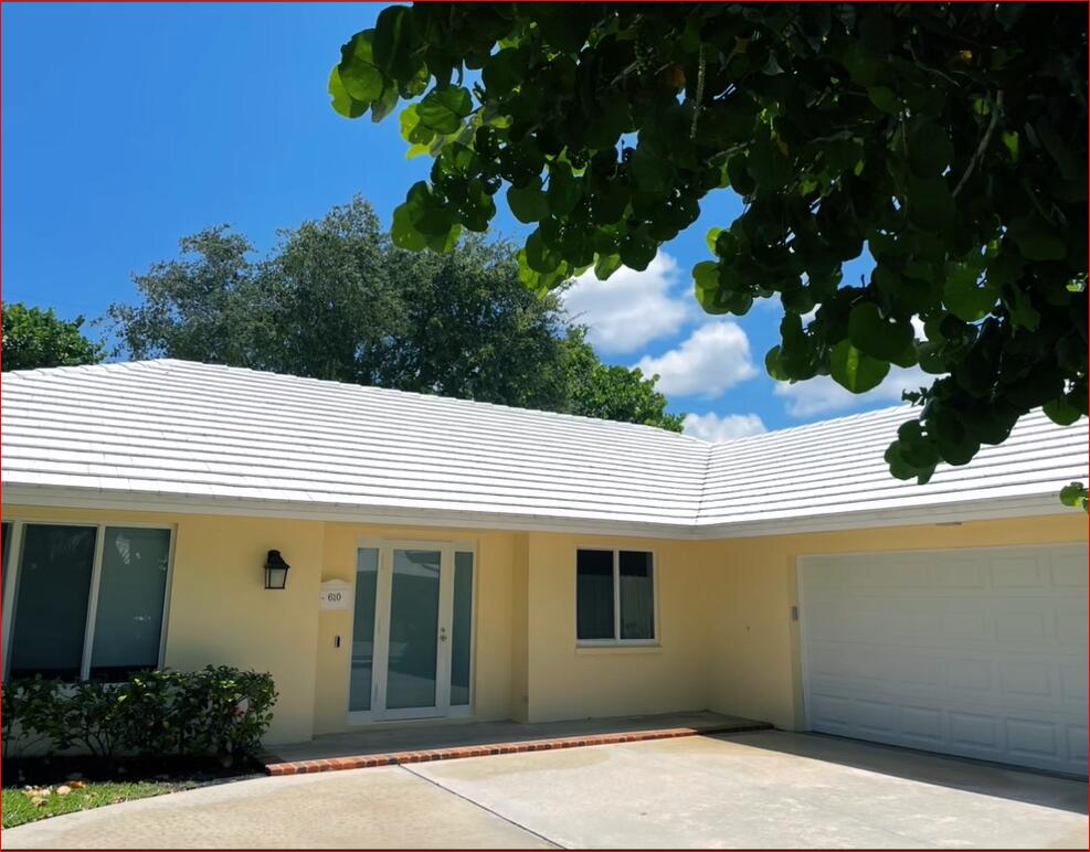 610 Juneberry Court Boca Raton, FL 33486 - Photo 4 of 11 a view of a white house with large windows