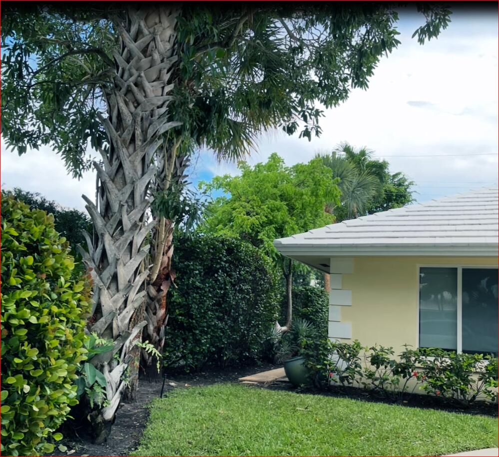 610 Juneberry Court Boca Raton, FL 33486 - Photo 6 of 11 a view of a house with a garden