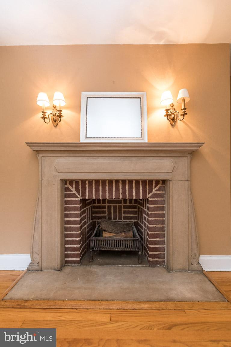 332 Suffolk Road Baltimore, MD 21218 - Photo 18 of 29 Decorative stone fireplace.