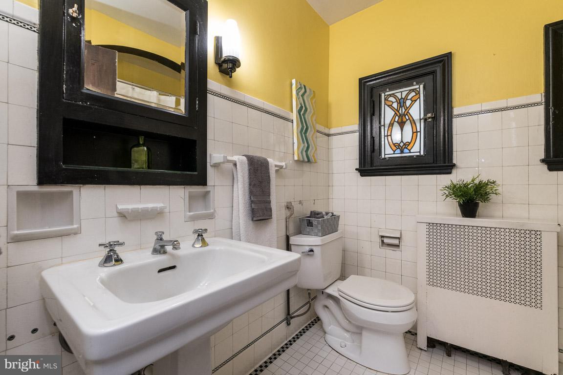 332 Suffolk Road Baltimore, MD 21218 - Photo 20 of 29 bead work tile, sconces, stained glass windows...