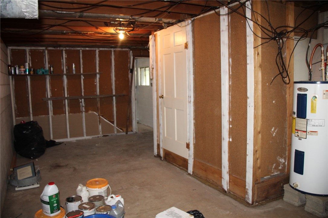 402 Canaan Road Marshall, AR 72650 - Photo 37 of 37 Unfinished basement space with exposed ceiling joists and visible electrical wiring