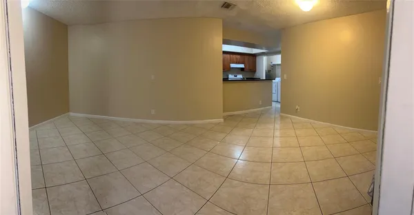an empty room with a bathroom