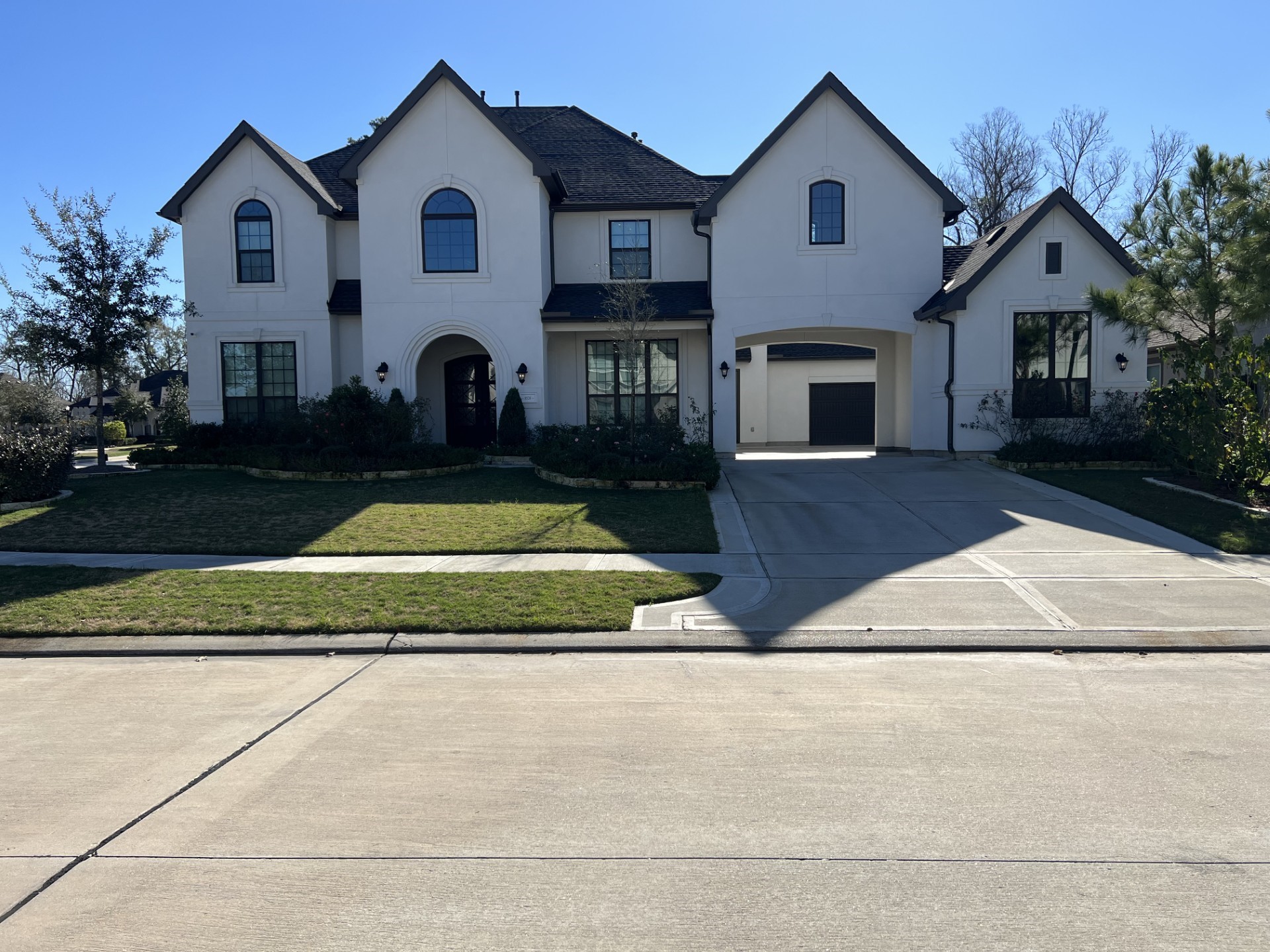 a view of house with outdoor space and view of a house