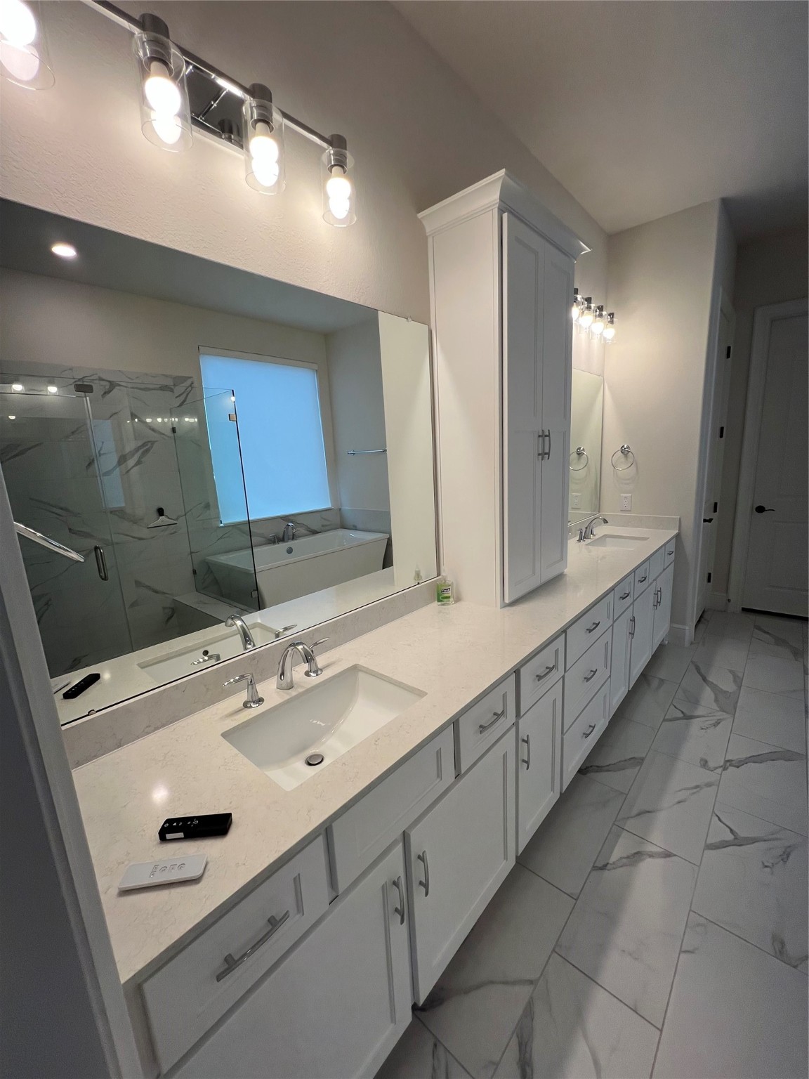8526 Tombron Grove Road Magnolia, TX 77354 - Photo 17 of 20 a bathroom with a double vanity sink and mirror