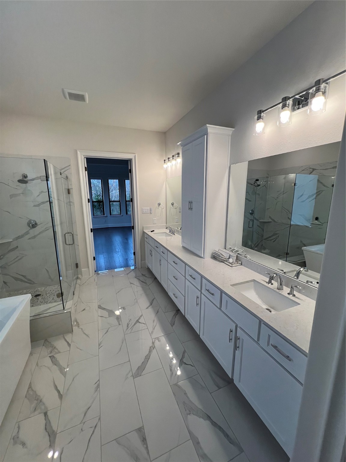 8526 Tombron Grove Road Magnolia, TX 77354 - Photo 18 of 20 a spacious bathroom with a double vanity sink and a mirror