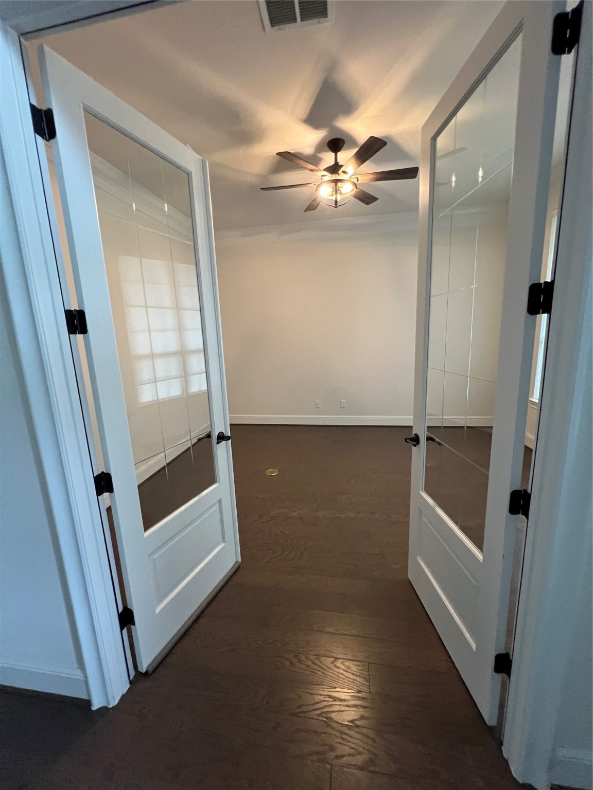 8526 Tombron Grove Road Magnolia, TX 77354 - Photo 20 of 20 an empty room with wooden floor and entrance