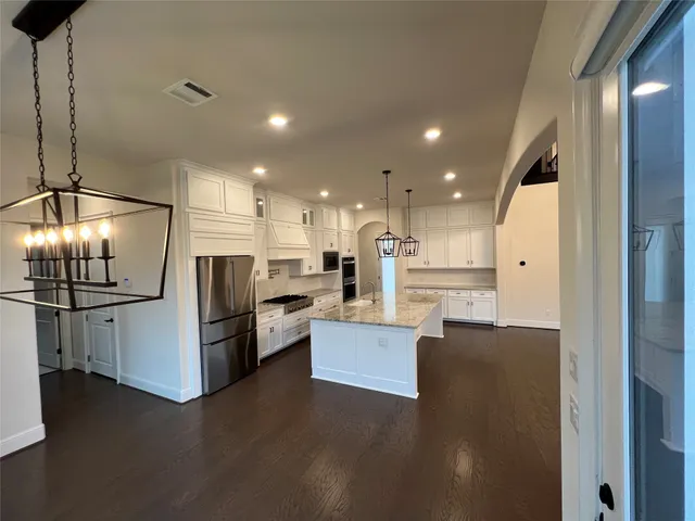 a view of hall way with furniture and staircase